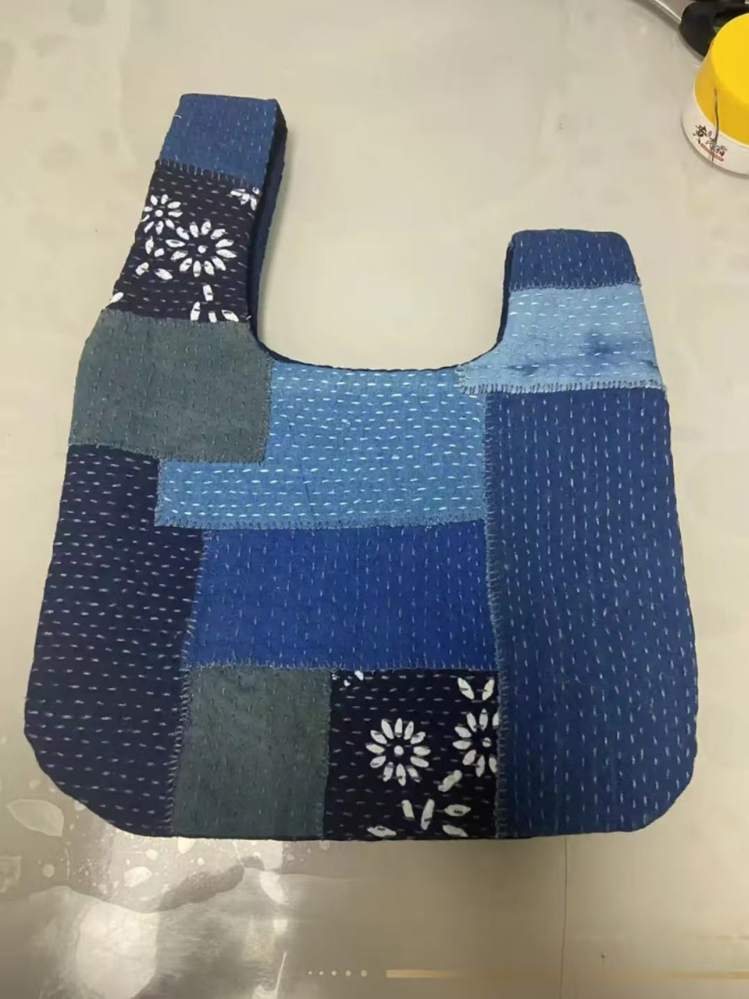 Sashiko Indigo Plant-Dyed Patchwork Knot Bag.