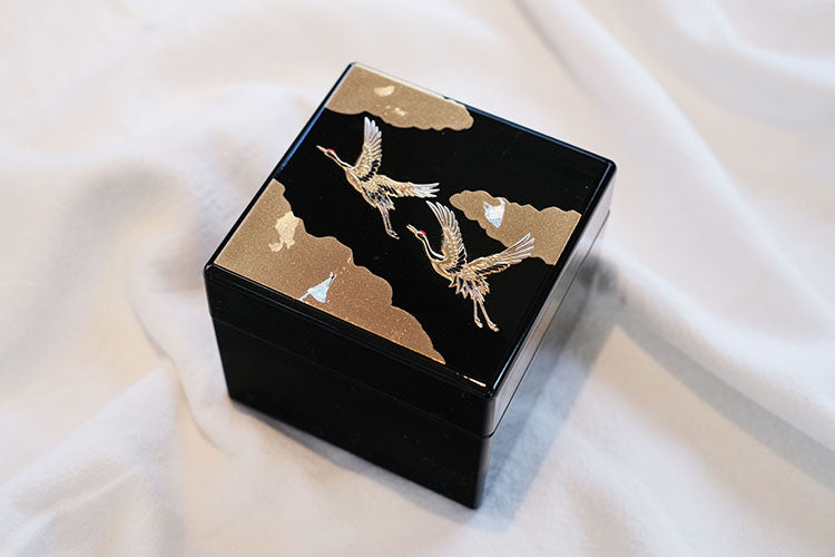 Rin Essense Japanese lacquerware jewelry box black square with gold cranes and cloud motif on white fabric