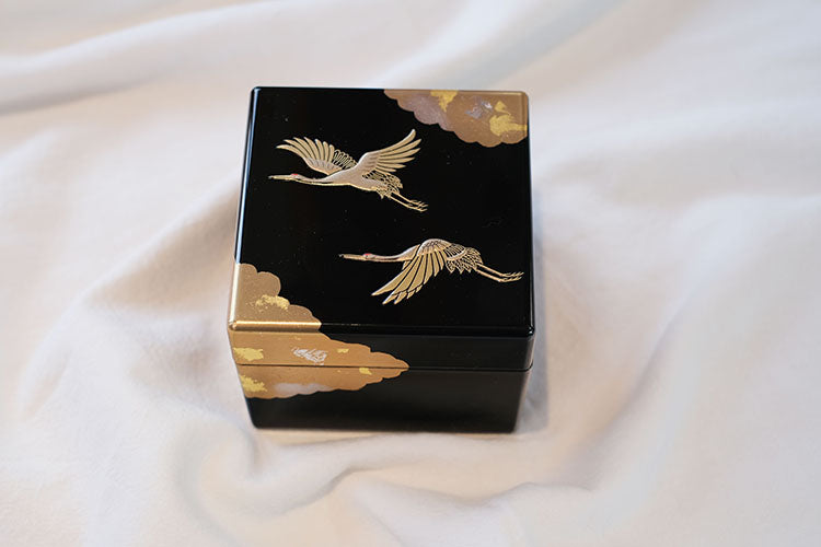 Rin Essense Japanese lacquerware jewelry box black square with gold cranes and cloud motifs on silk backdrop