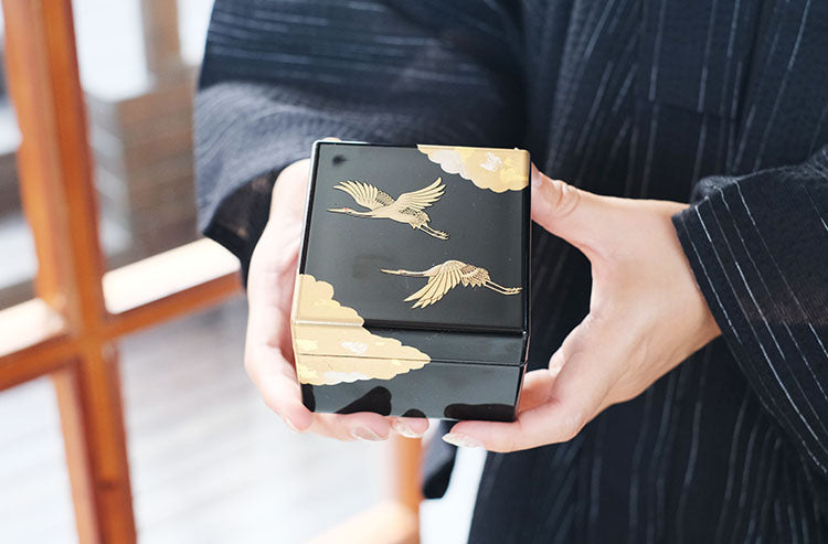 Rin Essense Japanese lacquerware jewelry box black with gold crane design held in hands elegant gift