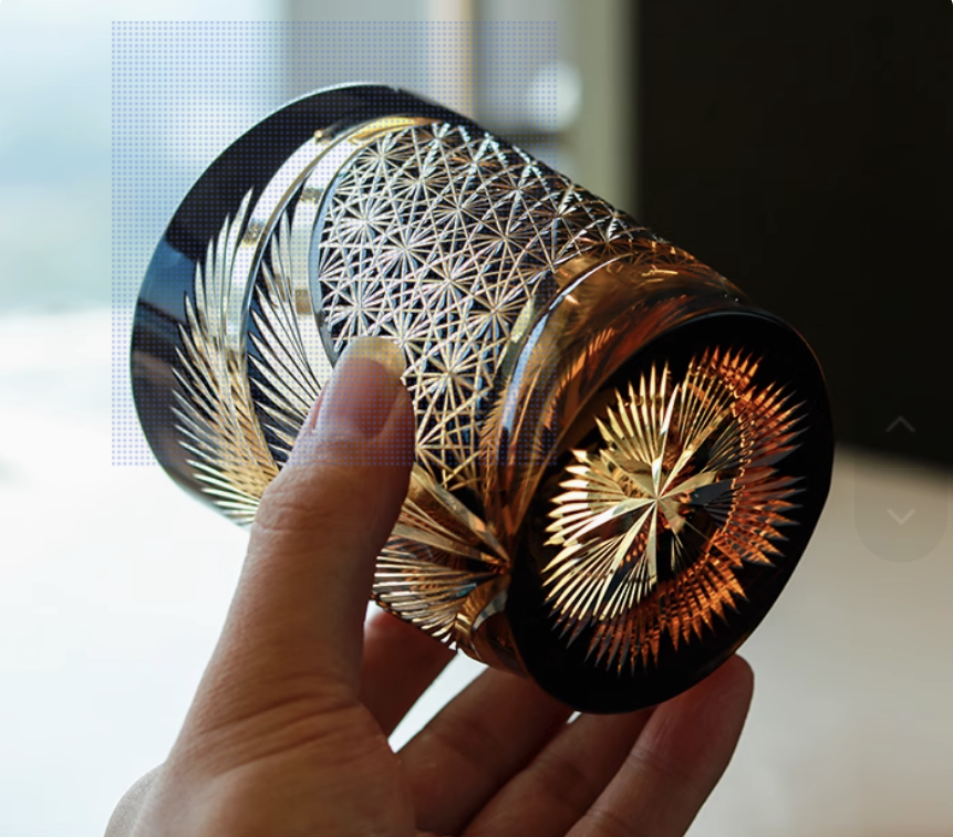 Rin Essense Japanese retro whisky glass cut crystal tumbler held in hand with intricate starburst and lattice patterns