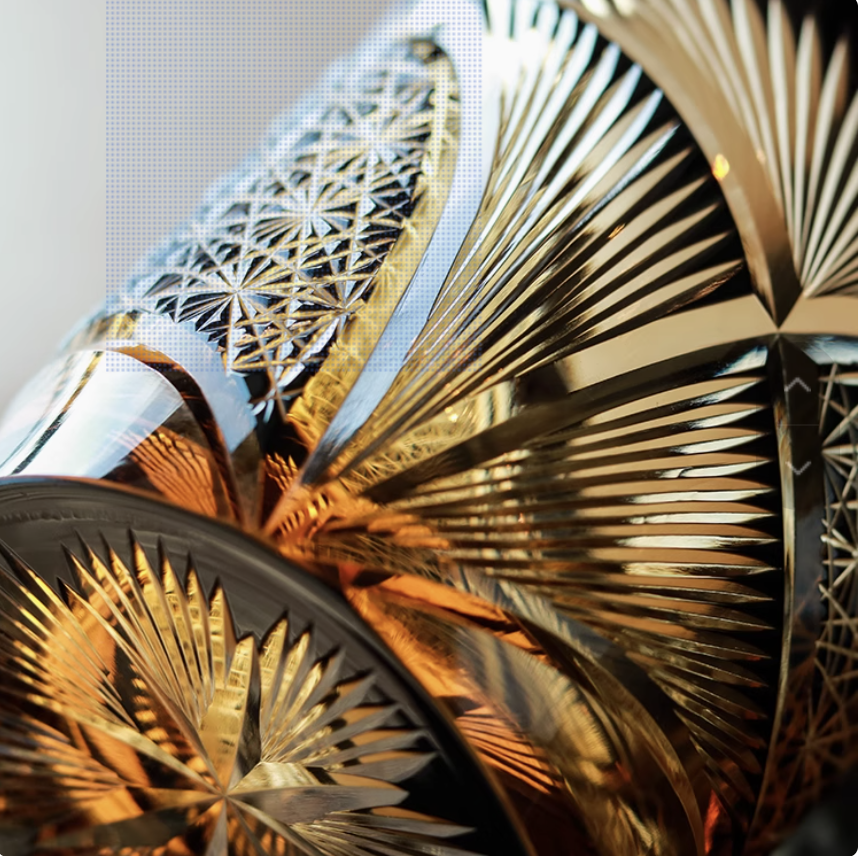 Japanese retro whisky glass set with intricate cut crystal patterns reflecting amber whisky and gold highlights