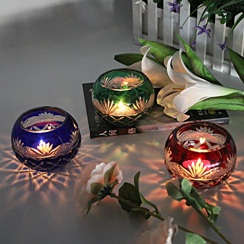 Japanese Edo Kiriko Glass Candle Holder – Round Ball Design in blue green and red with lit candles and floral decorations