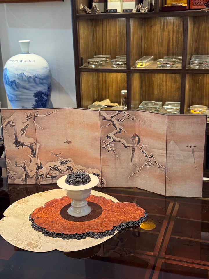 Japanese snow scene folding screen on table with decorative pedestal bowl and blue porcelain vase