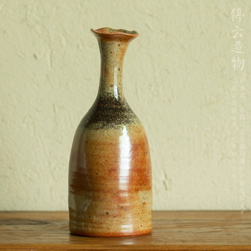 Rin Essense mini flower vase Japanese decor with earthy tones and a narrow fluted neck on wooden surface