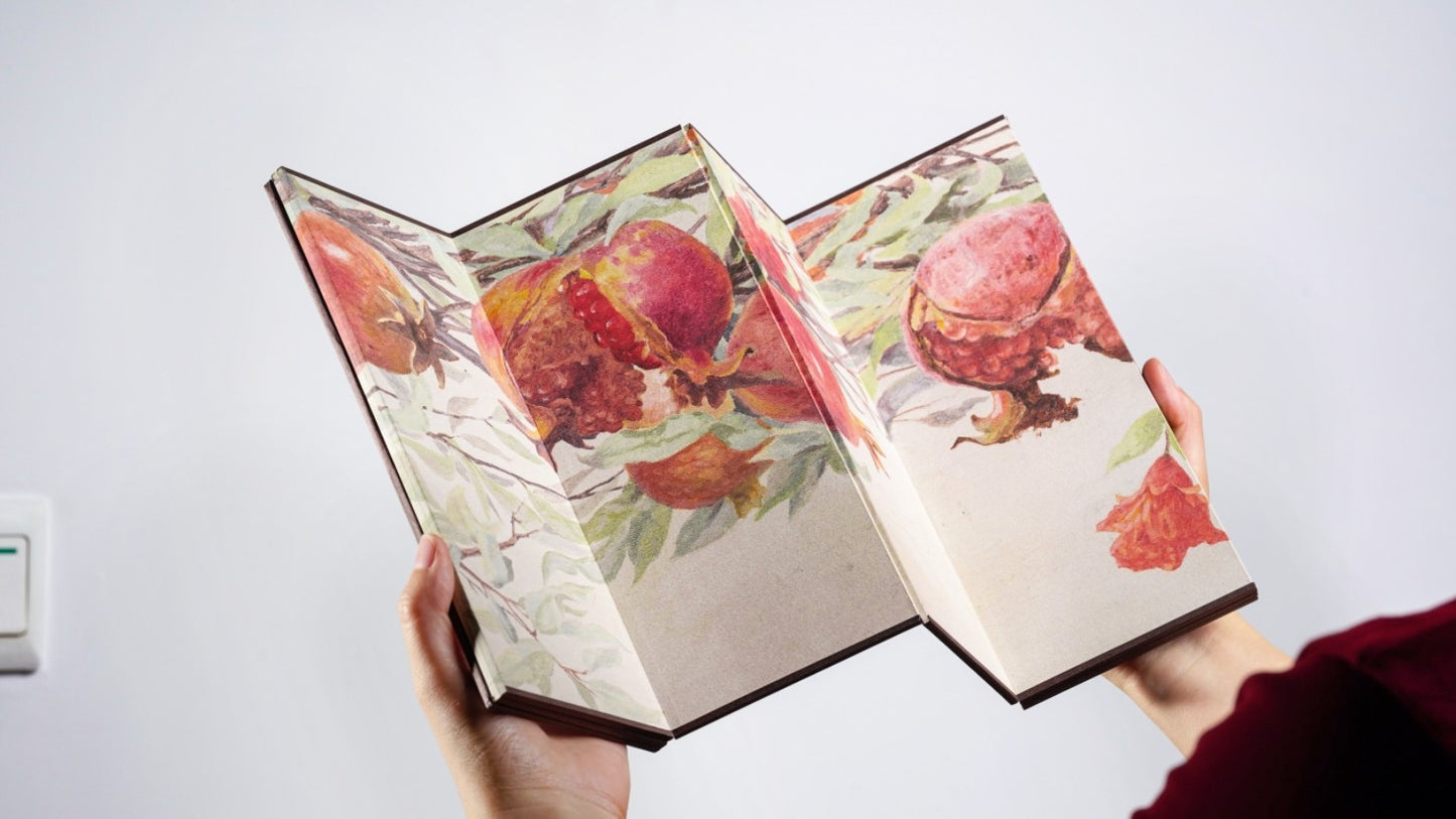Rin Essense decorative room divider folding screen with colorful pomegranate design held in hands