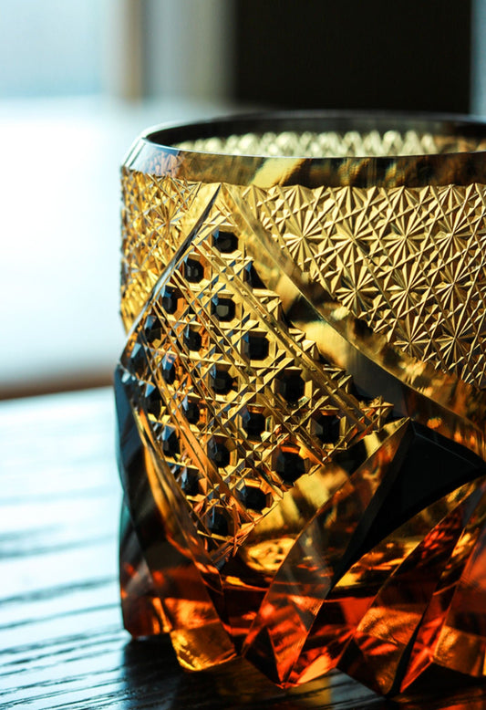 Satsuma Kiriko whiskey glass by Rin Essense amber cut crystal tumbler with intricate geometric gold pattern