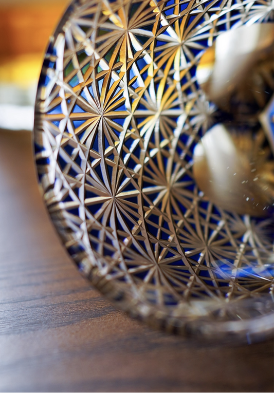Edo Kiriko whisky glass with blue cut crystal Asanoha star pattern handcrafted by Rin Essense on wood surface