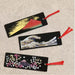 Set of three handcrafted lacquerware bookmarks featuring Mount Fuji The Great Wave and cherry blossom designs with red tassels