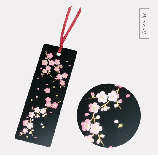 Black sakura cherry blossom bookmark with red tassel and floral detail close up handcrafted lacquerware bookmarks