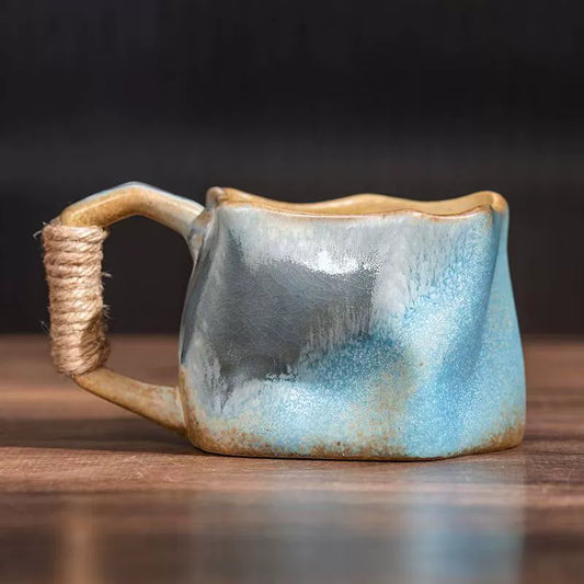 Rin Essense handmade stoneware coffee mug with coastal blue glaze and rope wrapped handle