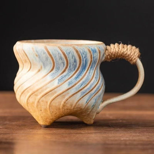 Rin Essense handmade stoneware coffee mug with blue beige swirl texture and rope wrapped handle
