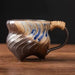 Rin Essense handmade stoneware coffee mug with wavy carved grooves blue accents and rope wrapped handle