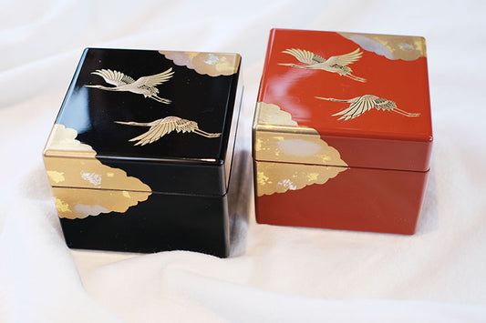 Japanese lacquerware jewelry box set of two square red and black boxes with gold cranes and cloud motifs for jewelry storage