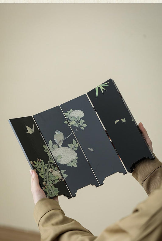 Rin Essense black lacquer table screen with painted birds peonies and bamboo held in hands