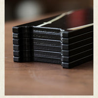 Rin Essense lacquer table screen with stacked black lacquer slats and weighted flat base detail