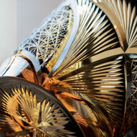 Japanese retro whisky glass set with intricate cut crystal patterns reflecting amber whisky and gold highlights