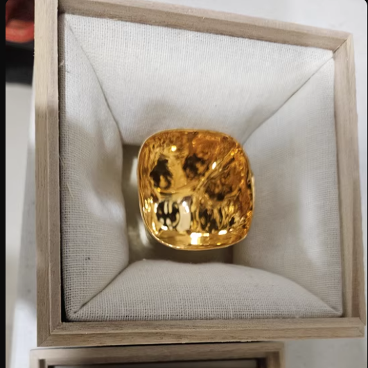Hand-shaped gilded Japanese cup displayed in a cushioned wooden box by Rin Essense