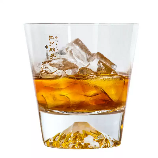 Handcrafted glass Japanese gift whiskey glass sake with ice and golden whiskey inside
