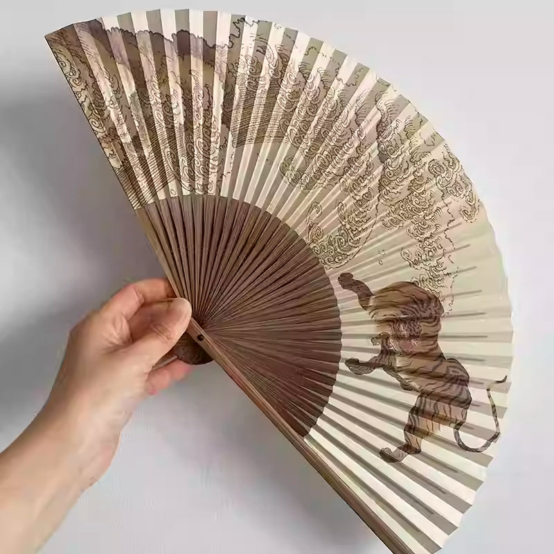 Rin Essense traditional hand fan with tiger and mountain design in earth tones