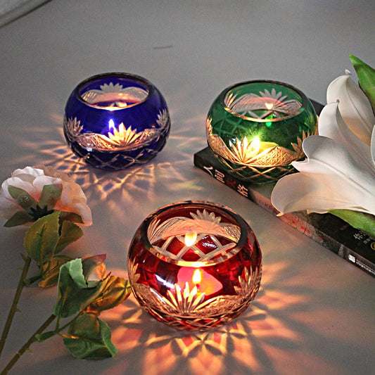 Japanese Edo Kiriko Glass Candle Holder – Round Ball Design in red blue and green with lit candles and floral decorations