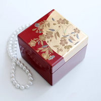 Rin Essense elegant red and gold floral jewelry box with pearl necklace on white background