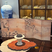 Japanese snow scene folding screen on table with decorative pedestal bowl and blue porcelain vase