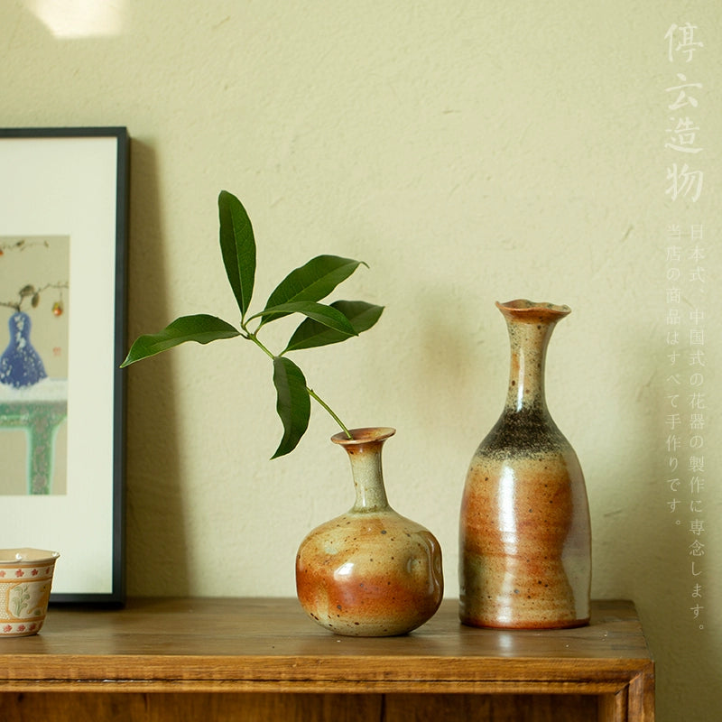 Rin Essense mini flower vase Japanese decor with natural glaze and green leaf on wooden table