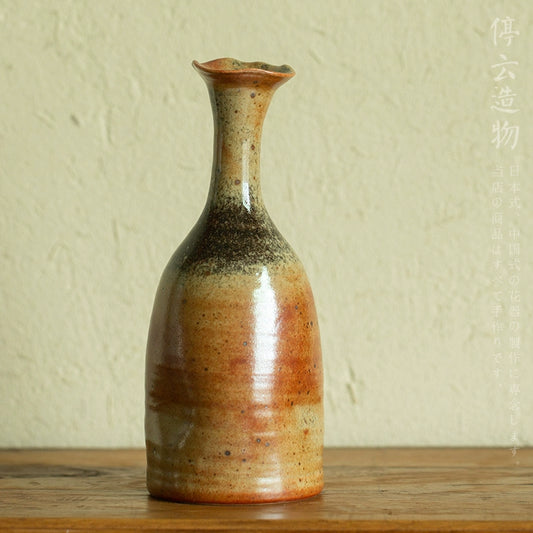 Rin Essense mini flower vase Japanese decor with earthy tones and a narrow fluted neck on wooden surface