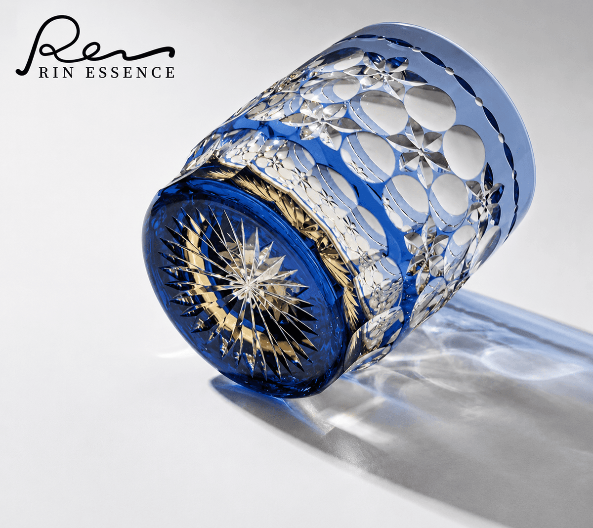 RIN ESSENCE blue and clear crystal glass whiskey with intricate cut designs and starburst base