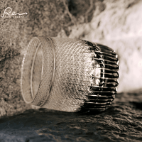 Rin Essense whiskey glass with intricate cut glass design showcasing whiskey with glass elegance