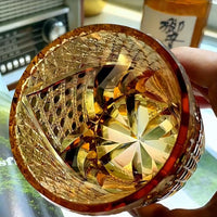 Satsuma Kiriko whiskey glass amber cut crystal with star cut base and intricate geometric patterns