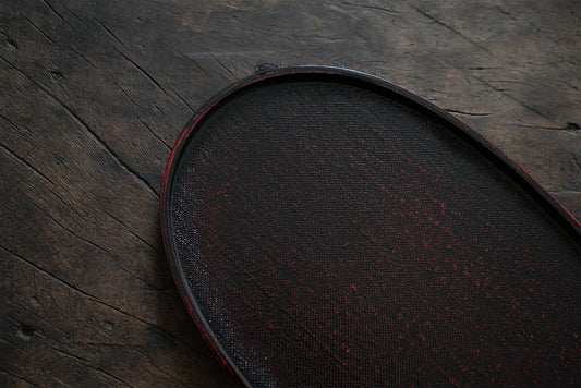 Rin Essense dark wooden tea tray with textured surface on rustic wooden background