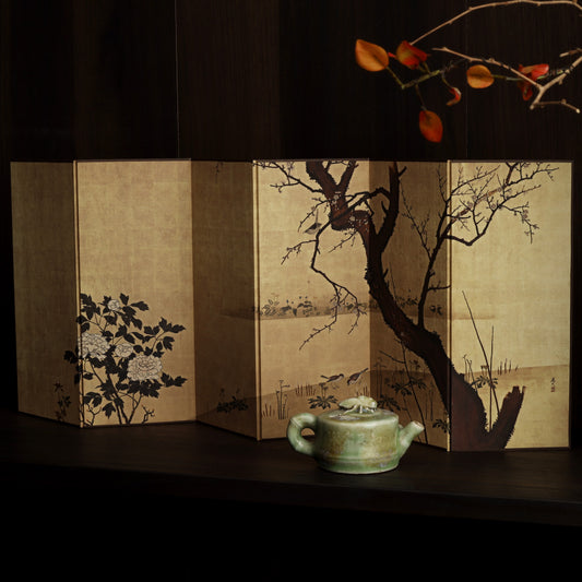 Rin Essense Japanese shoji folding screen with hand painted tree and floral panels beside a green teapot