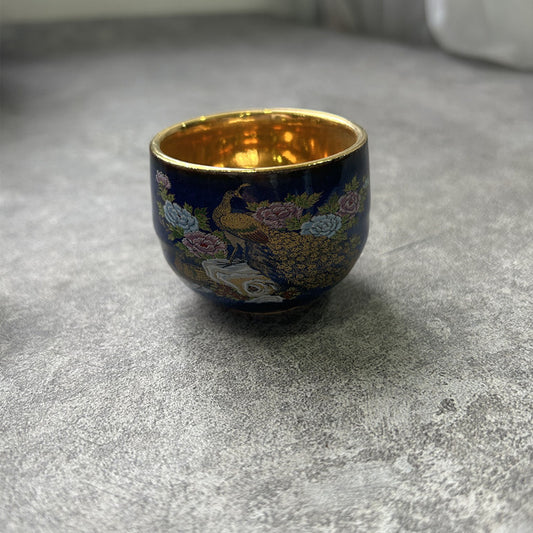 Rin Essense sake cup featuring traditional Japanese ceramic drinkware with floral and peacock design and gold interior