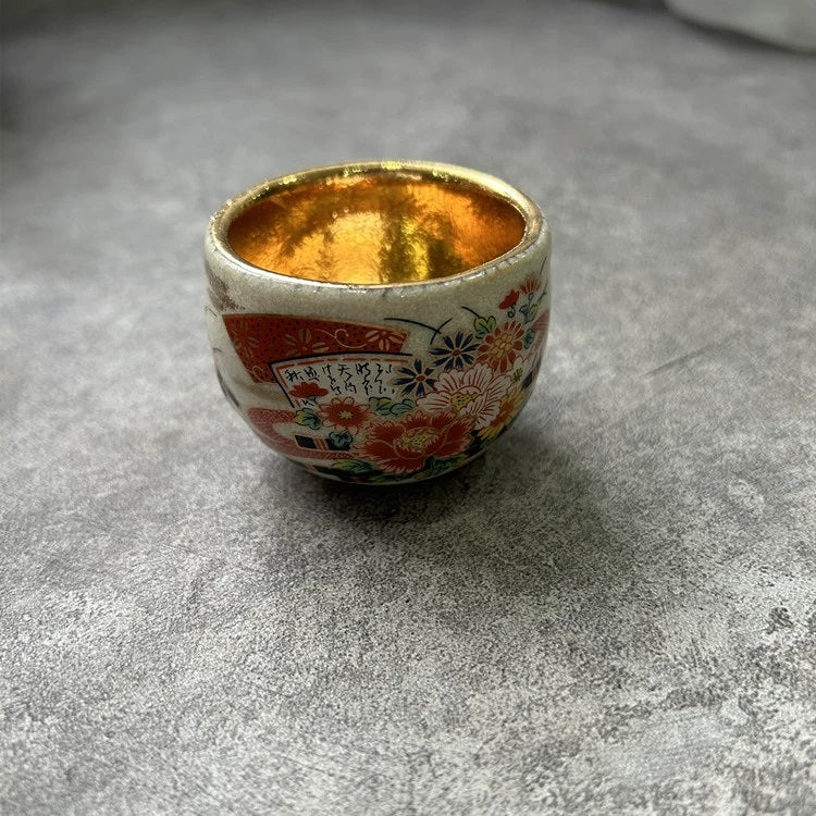Rin Essense sake cup with gold interior and floral design traditional Japanese ceramic drinkware