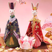 Unique Japanese home decor present featuring traditional rabbit dolls dressed in kimono with decorative fans and cherry blossom accents