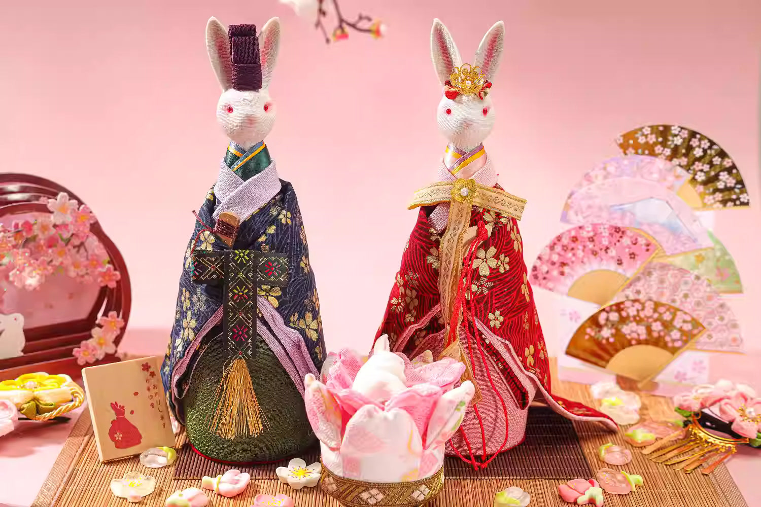 Unique Japanese home decor present featuring traditional rabbit dolls dressed in kimono with decorative fans and cherry blossom accents