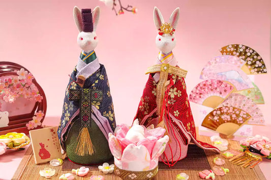 Unique Japanese home decor present featuring traditional rabbit dolls dressed in kimono with decorative fans and cherry blossom accents