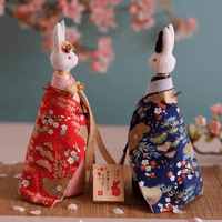 Rin Essense unique Japanese home decor present featuring two white bunny figurines dressed in detailed red and blue floral kimonos
