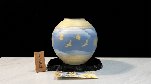 Rin Essense collectible art Japanese pottery vase with birds design on blue and yellow background