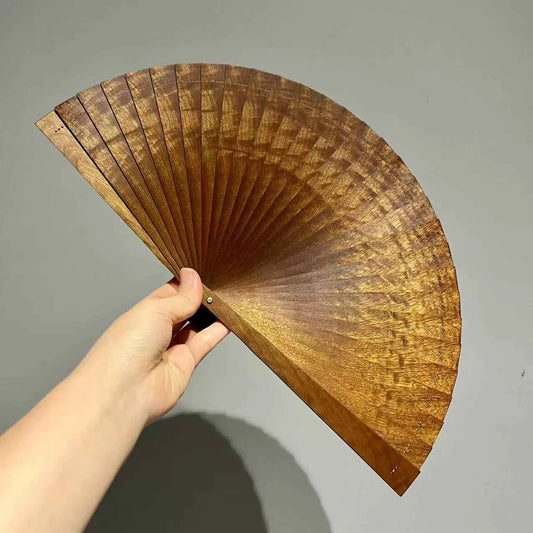 Rin Essense folding fan hand with brown textured wooden slats held open against a plain background