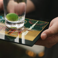 Yamanaka Lacquerware Makie Coaster – Timeless Japanese Craft with intricate gold and colorful designs holding a glass cup