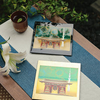 Yamanaka Lacquerware Makie Coaster – Timeless Japanese Craft featuring traditional temple design with gold accents on a table